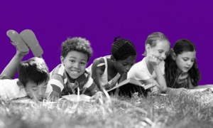 diverse children reading outside