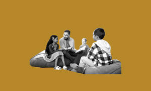 Adult and group of children talking