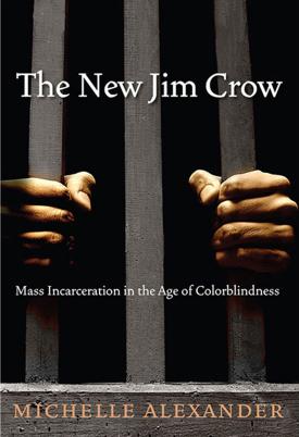 The New Jim Crow cover, hands grasped around prison bars